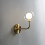 Retro brass curved wall lamp with a brass finish and clear glass ball featuring an illuminated bulb for bedroom decorbites wall lamp