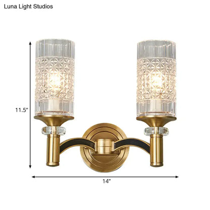 Gold-toned retro brass wall light with gridded crystal shades and black accent arms for living room use