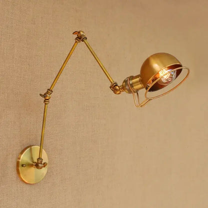 Retro brass swing arm wall sconce with spherical shade and exposed bulb by decorbites golden loft adjustable wall lamp