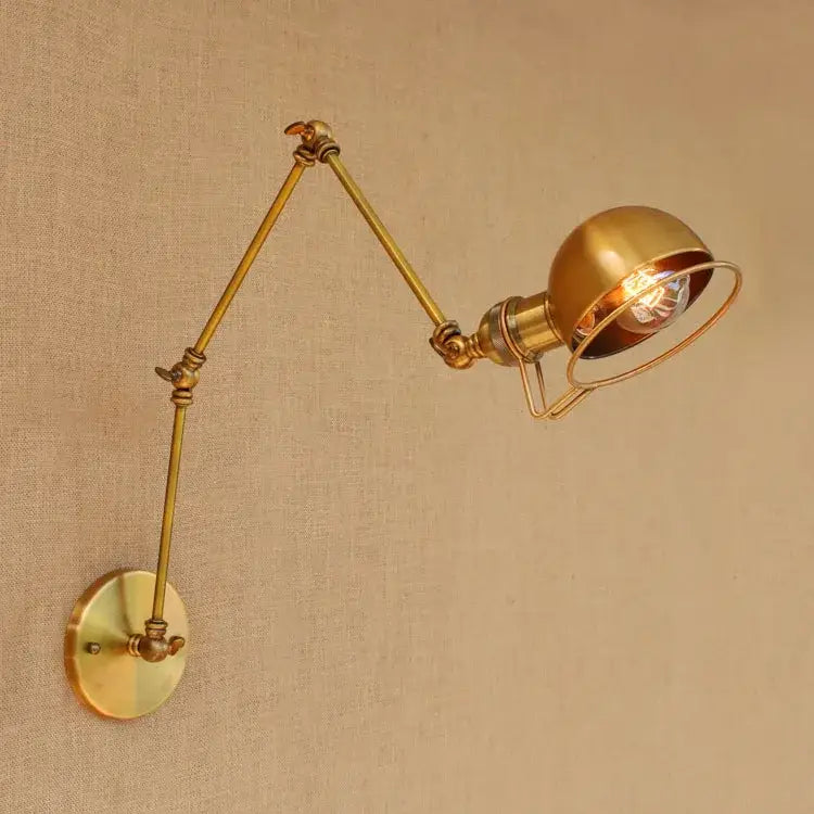 Retro brass swing arm wall sconce with spherical shade and exposed bulb by decorbites golden loft adjustable wall lamp