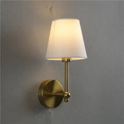 Brass-finished wall lamp with gold led retro design and tapered white fabric shade for bedroom sconce lighting