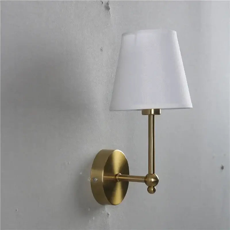 Gold finished wall lamp with white fabric shade featuring led retro wall design for bedroom use