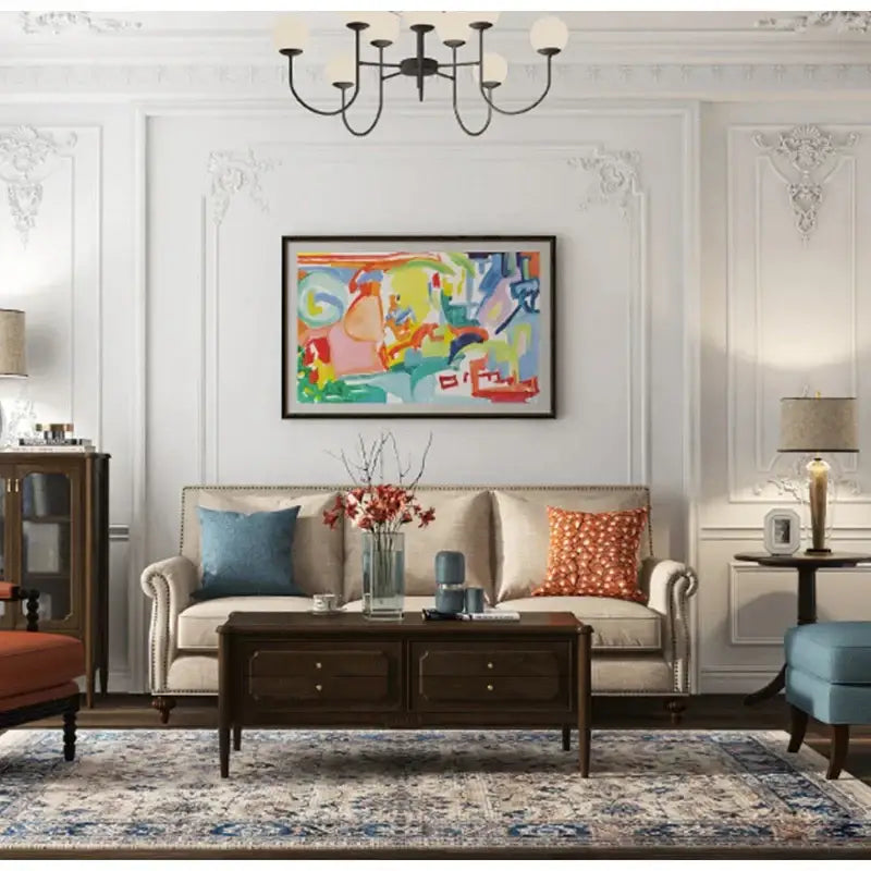 Beige upholstered sofa with rolled arms features a retro brick red embroidered geometry pillow case and blue pillow