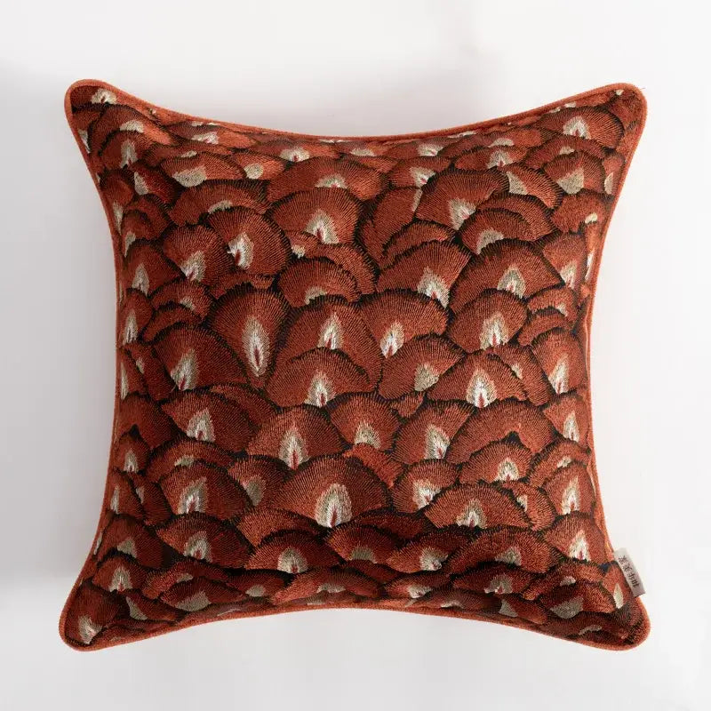A rust-colored velvet retro brick red embroidered geometry pillow case with cream and dark brown fan-shaped motifs