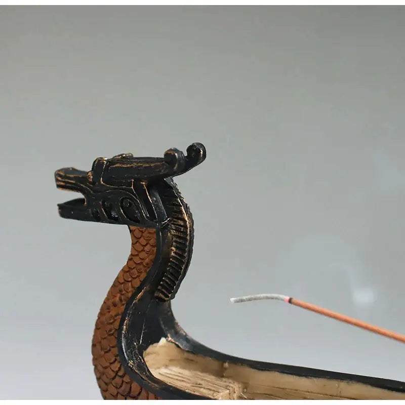 Black and brown bronze dragon boat incense holder with detailed scales and ornate head design for living room decorbites decor