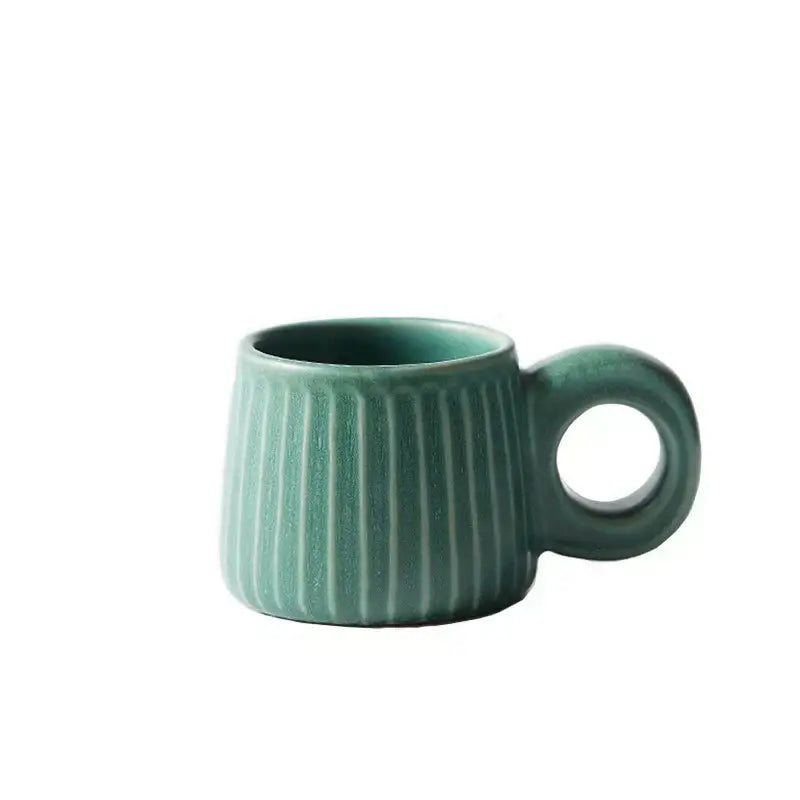 Teal handmade nordic ceramic mug with vertical ridges and circular ring handle for kitchen coffee decorbites use