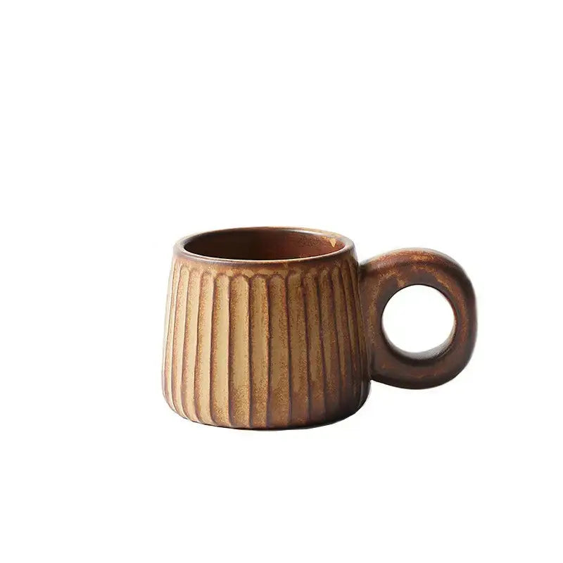 A rustic brown ceramic mug with vertical ribbed texture and circular handle by decorbites handmade nordic ceramic