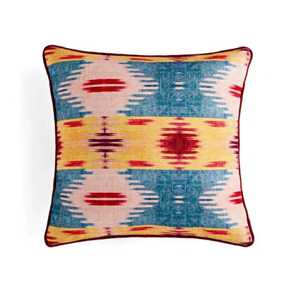 Retro circus cream pillow cover with tassels featuring vibrant blue yellow and red geometric pattern textured weave decorbites circus retro decor pillow cover