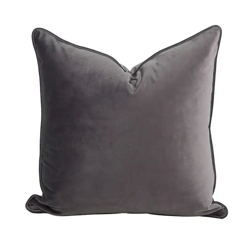 A plush charcoal gray velvet pillow cover with a soft textured surface and tassels decorbites circus retro throw decor