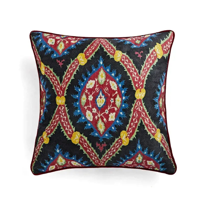 Square decorative pillow cover with intricate red blue yellow and green embroidery on dark background for decorbites circus retro decor