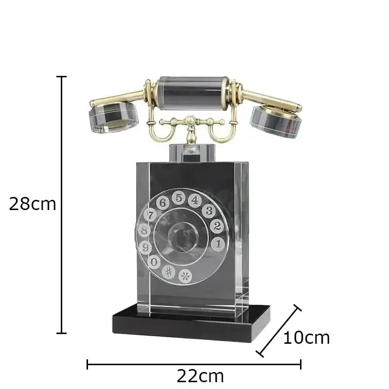 A sleek transparent crystal telephone sculpture with gold accents and black base for retro office desk decor