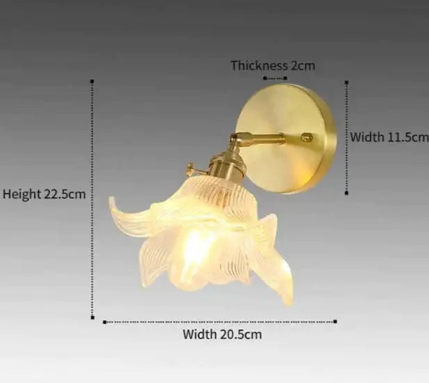 Gold-toned retro copper flower brass wall sconce with translucent petal-shaped fluted glass shade for bedroom lighting