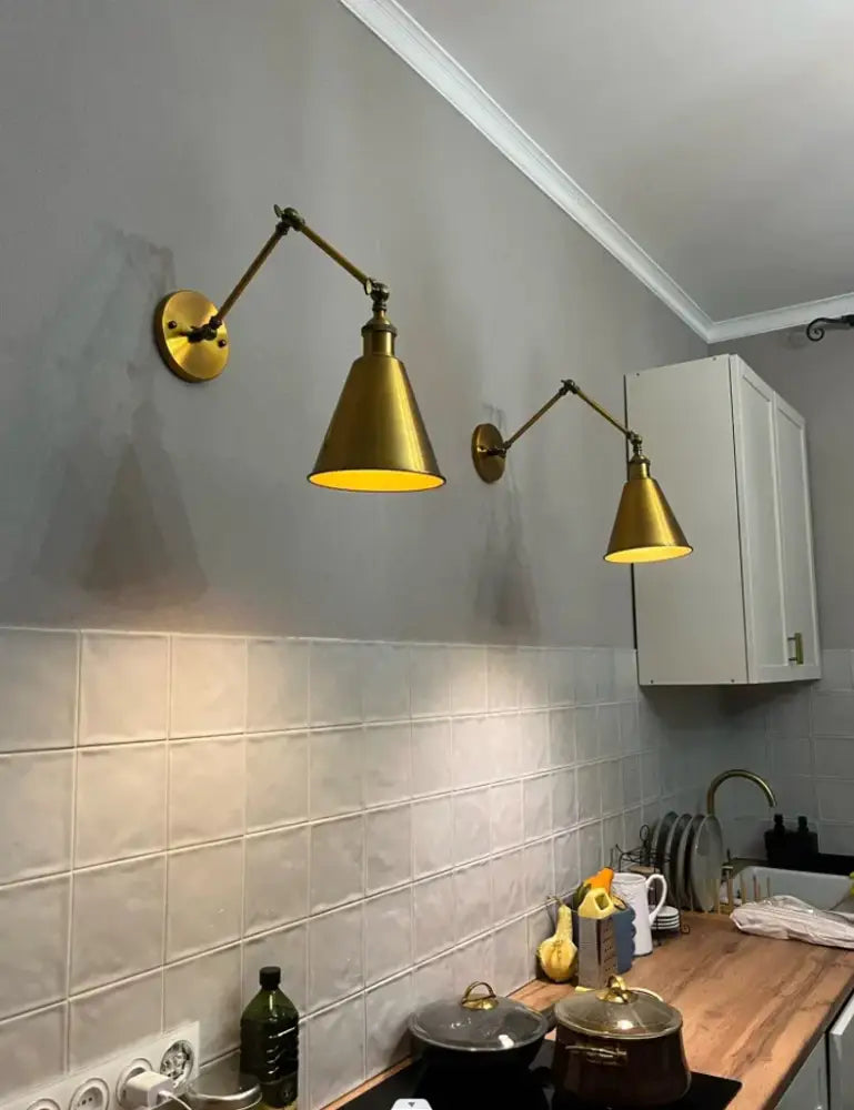 Brass wall lamp with adjustable conical shade and articulated arm in retro copper iron loft decorbites iron loft style