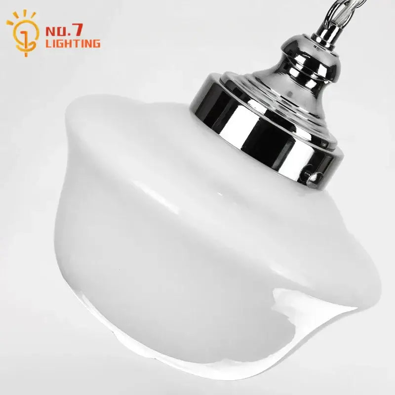 Retro cream glass pendant light featuring a white frosted cream glass pendant with polished chrome fixture