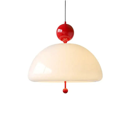 A retro cream glass pendant light with glossy red accent spheres and an off-white domed shade for dining room decorbites cream glass