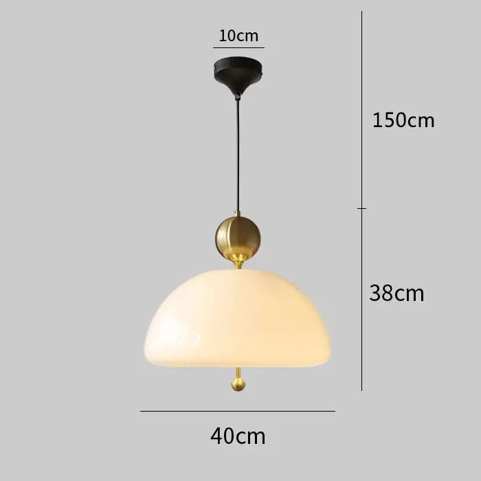 A pendant light with warm opalescent cream glass dome and brass accents for dining room decorbites cream glass retro