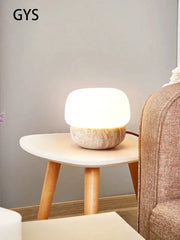 Soft glowing cream mushroom table lamp with textured stone base from decorbites for bedroom decor