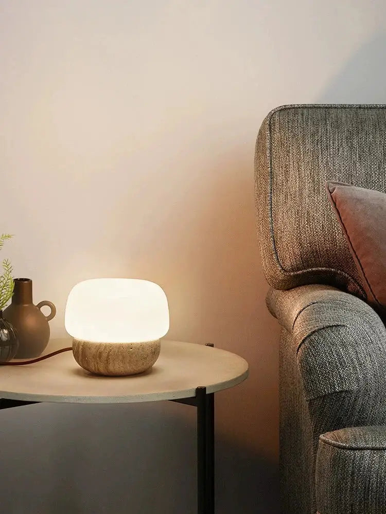 A warm cream mushroom table lamp with a smooth white top and textured beige stone base for decorbites bedroom decor
