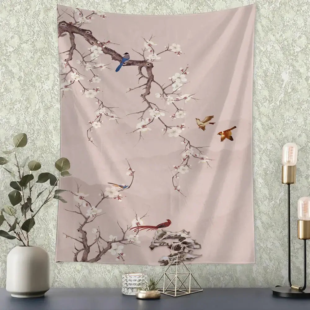 Soft pink wall tapestry with white blossoms and colorful birds displayed with decorbites flying crane wall hanging decor