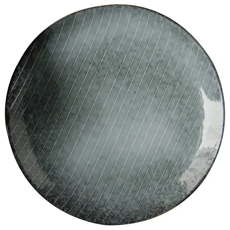 Retro dark gray speckled ceramic dinner plate with matte finish and diagonal ridges from decorbites ceramic dinner collection