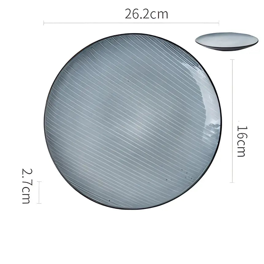 A sleek matte dark gray speckled ceramic dinner plate with subtle diagonal ridges and a slightly raised rim by decorbites ceramic dinner
