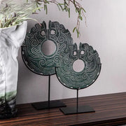 Two dark green jade disc totem resin statues with intricate carvings on black stands for decorbites geometric totem decor