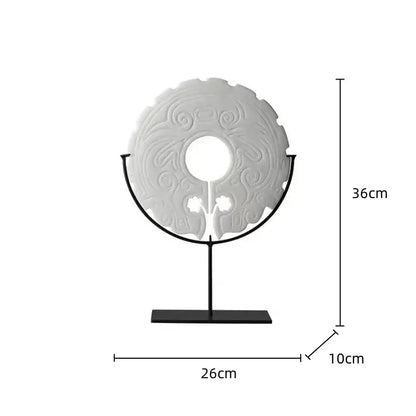 White intricately carved circular decorative geometric totem resin statue on black metal stand for living room decorbites decor