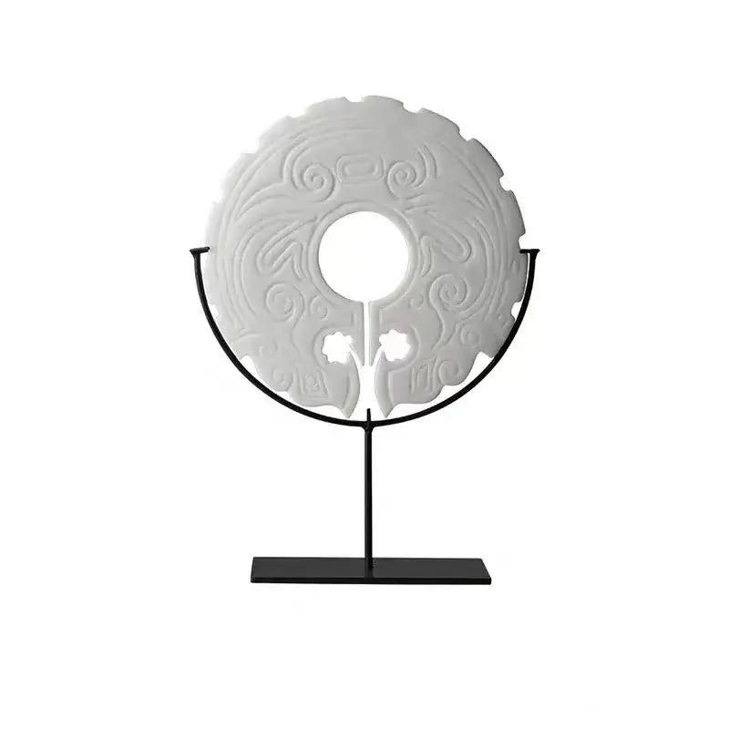 White jade disc with intricate swirling carvings on black metal stand for retro dark green geometric totem resin decorbites statue