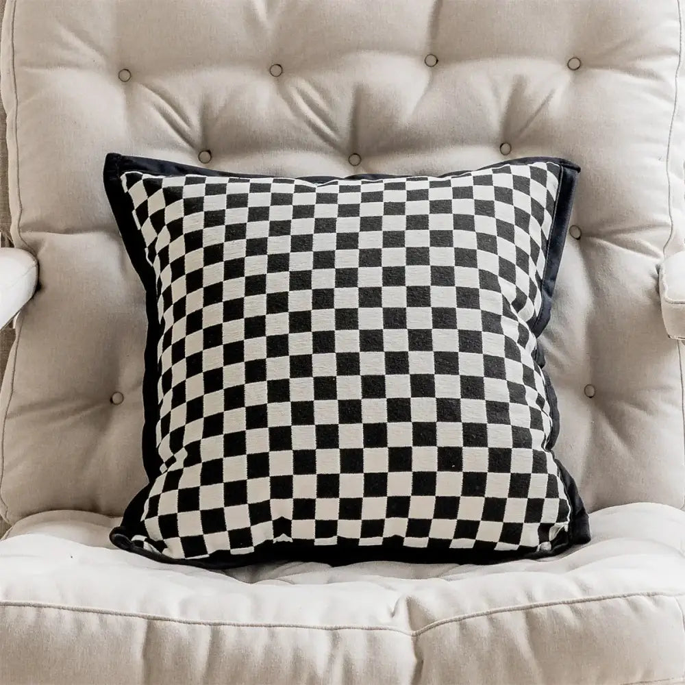 Black and white checkered throw pillow cover with black velvet trim complementing retro dark green embroidered jacquard luxury pillow