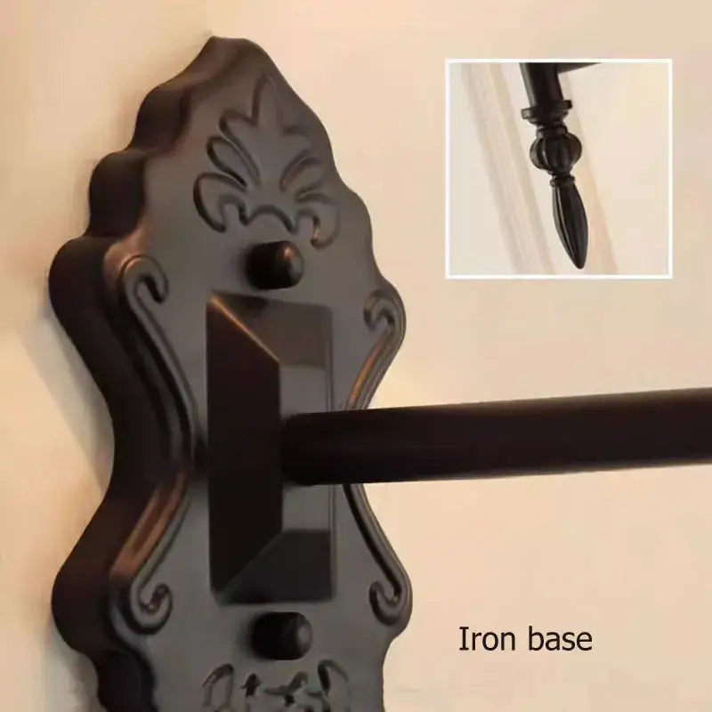 Dark bronze ornate iron wall lamp base with decorative scrollwork and central rectangular slot for decorbites iron wall lamp