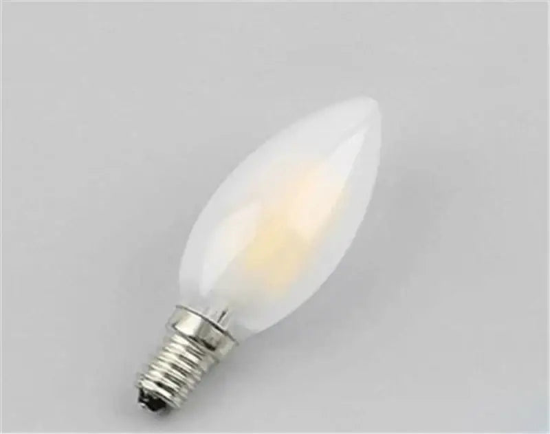 A frosted white retro decorbites frosted e14 led candle bulb with metallic screw base for dining room chandeliers