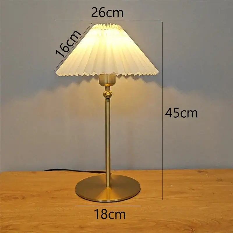A brass-finished floor lamp with pleated white fabric shade and adjustable angle for bedroom reading decorbites adjustable angle