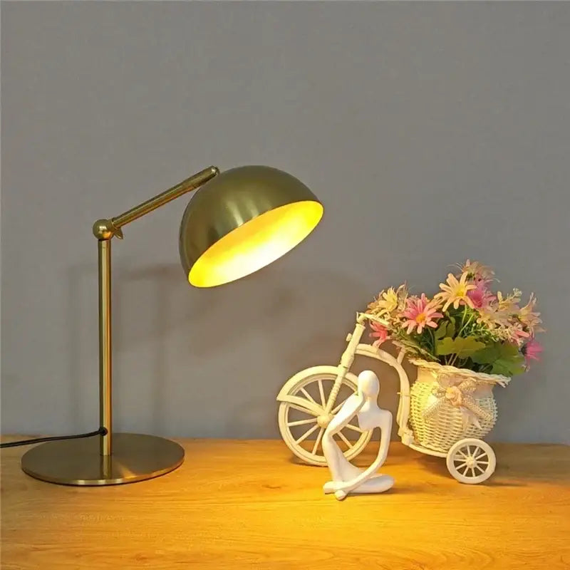 Brass-finished retro gold floor lamp with adjustable angle and dome shade emitting warm light for bedroom reading decorbites adjustable angle