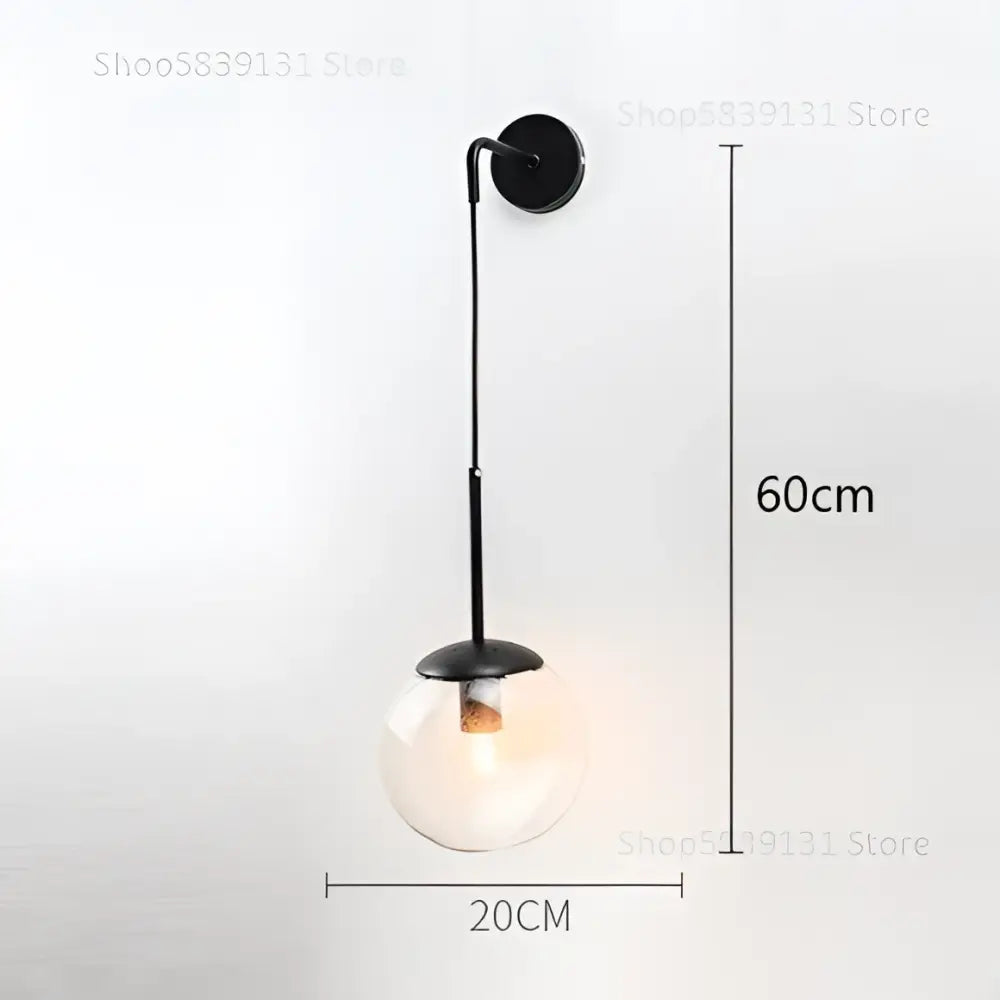 Black metal wall lamp with clear glass ball bulb from decorbites glass ball collection for bedroom sconce decor