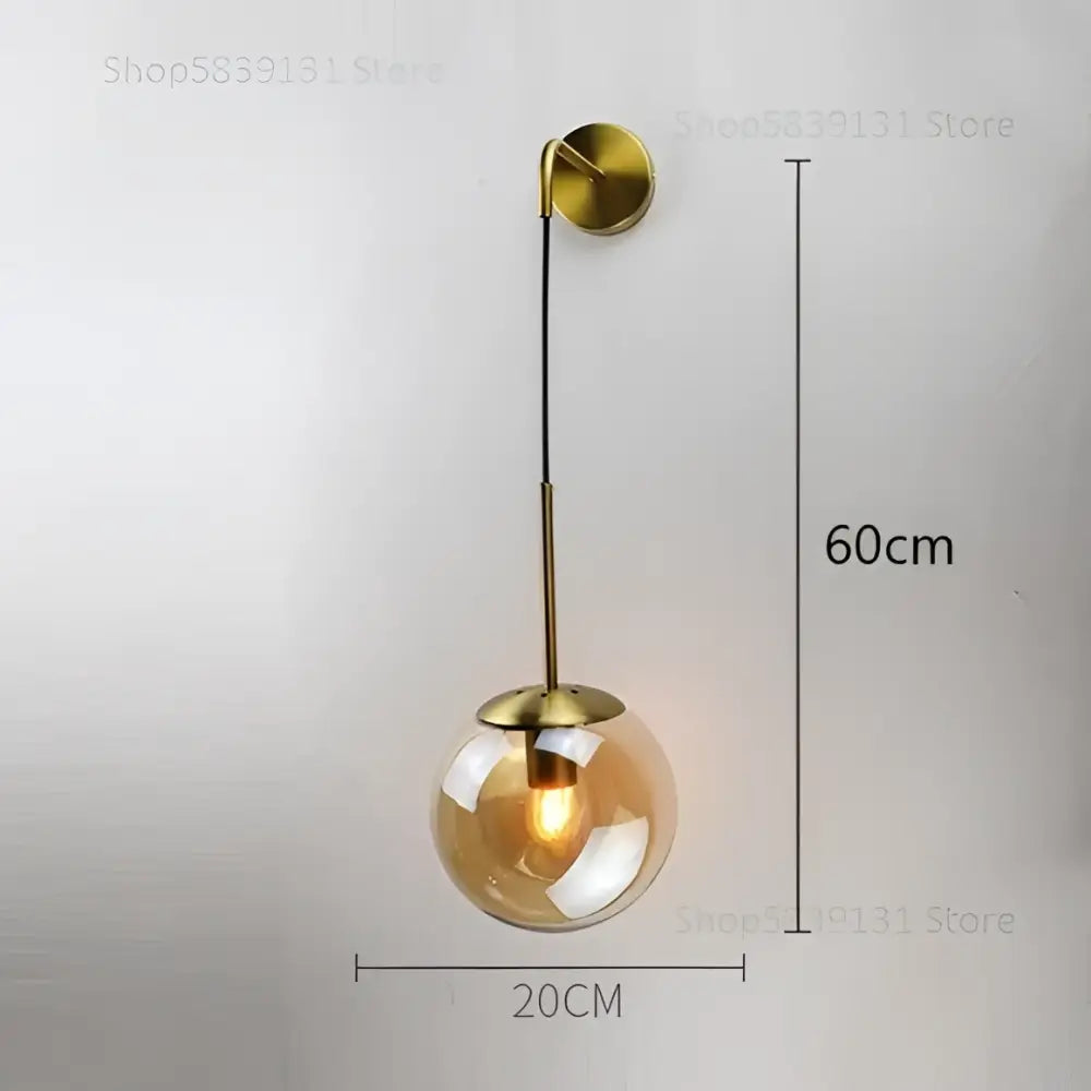Brass-finished wall lamp with amber glass ball globe and slender stem retro gold glass ball wall decorbites glass ball