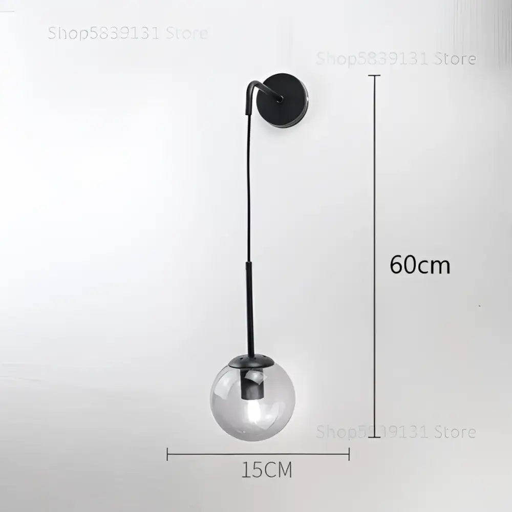 A sleek black wall lamp with a transparent glass ball and slender stem perfect for modern decorbites glass ball wall use