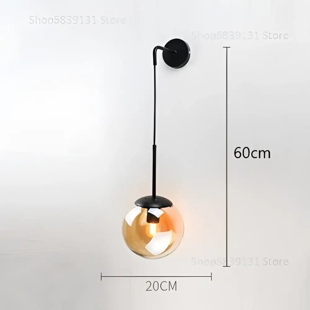 A sleek black metal wall lamp with a 20cm amber-tinted decorbites glass ball for smoked bedroom sconce decor