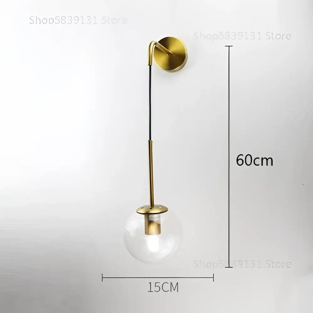 Retro gold glass ball wall lamp with gold-toned metal stem and clear glass globe for bedroom decorbites glass ball sconce