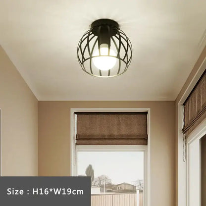 Black wrought iron cage retro ceiling lamp with warm glowing bulb ideal for bedroom decorbites iron cage lighting