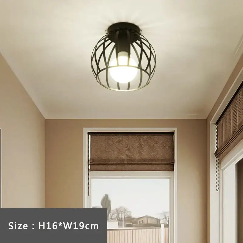 Black wrought iron cage retro ceiling lamp with warm glowing bulb ideal for bedroom decorbites iron cage lighting