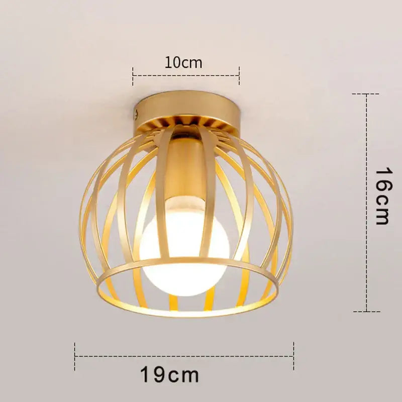 Gold-colored iron cage retro ceiling lamp with spherical bulb providing warm glow lighting for bedroom decorbites iron cage