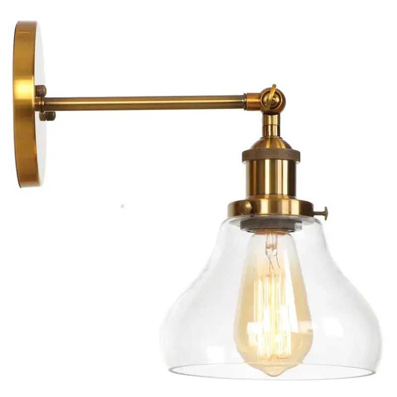 Brass-finished decorbites gold led wall sconce with clear glass shade and exposed filament bulb for bedroom use