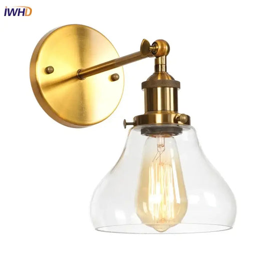 Brass-finished retro gold led wall sconce with clear glass shade and exposed filament bulb for bedroom decorbites gold led
