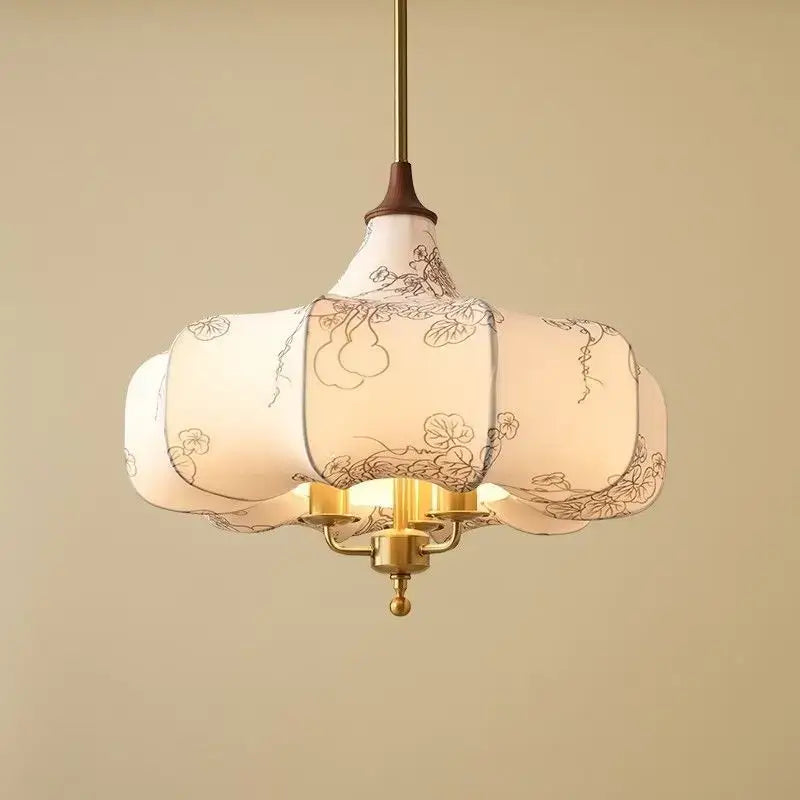 Delicate off-white pendant lights with black floral patterns suspended by brass rod for decorbites gold lustre retro bedroom decor