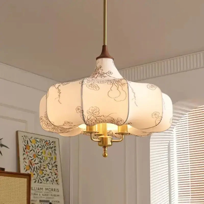 Delicate off-white lantern-style pendant lights with black floral embroidery and brass frame for bedroom decorbites gold lustre