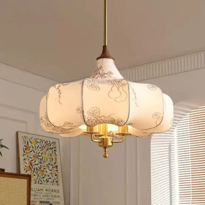 Delicate off-white lantern-style pendant lights with black floral embroidery and brass frame for bedroom decorbites gold lustre