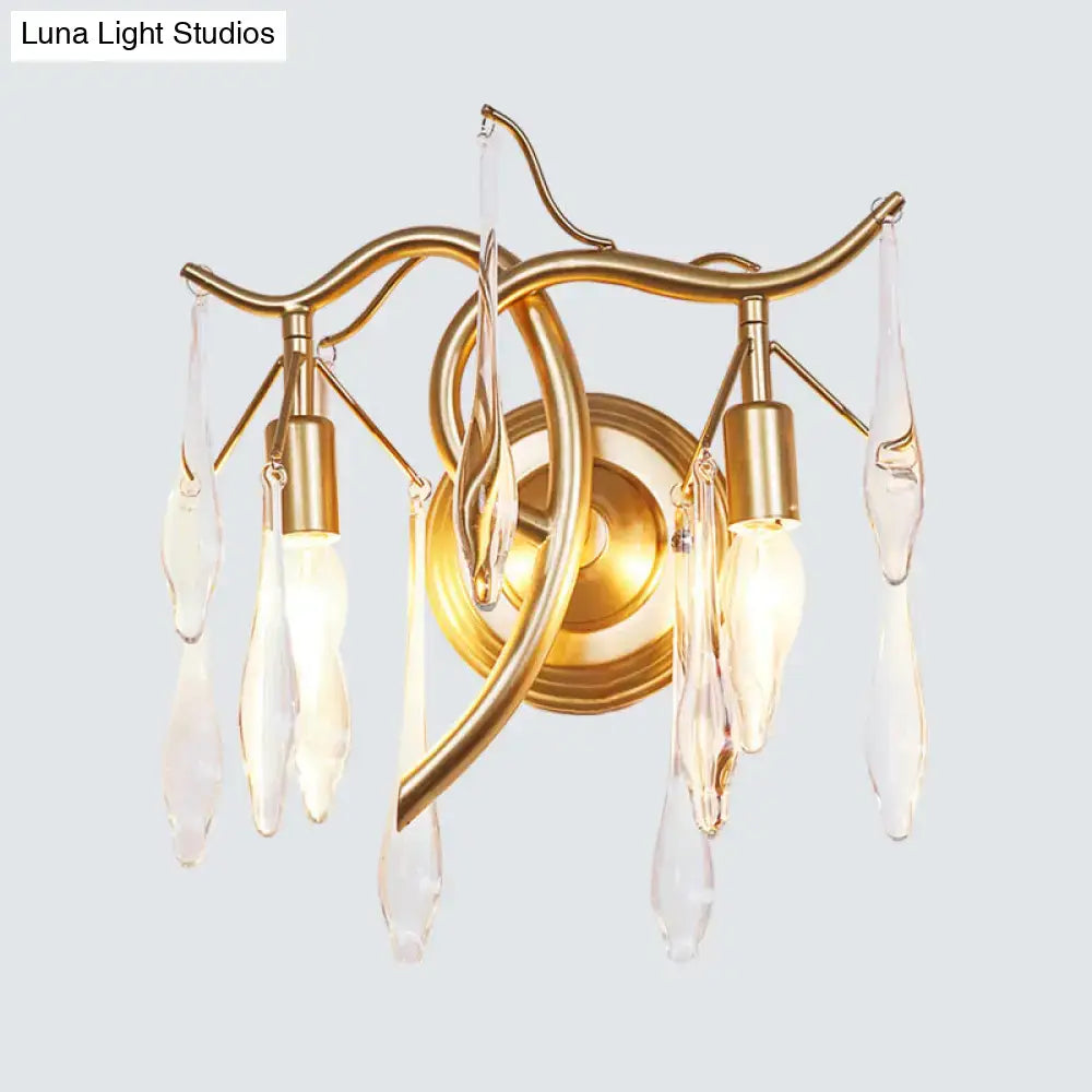 Gold-toned retro gold raindrop wall lamp with curved metal arms and clear crystal teardrop pendants for bedroom lighting