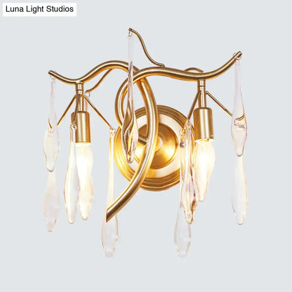 Gold-toned retro gold raindrop wall lamp with curved metal arms and clear crystal teardrop pendants for bedroom lighting