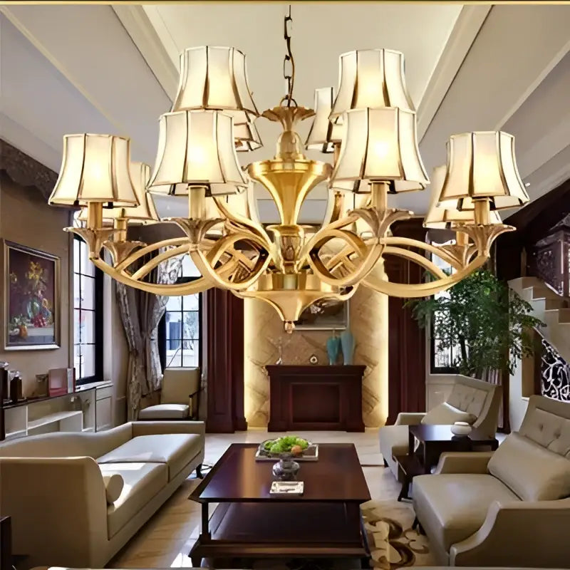 Gold-toned decorbites copper villa chandelier with multiple cream-colored lampshades for staircase decor