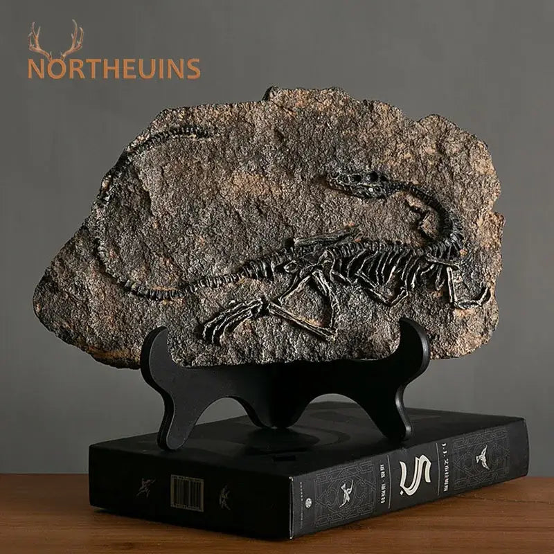 Retro gray and brown dinosaur fossil figurine with dark brown fossil embedded in rock on black stand for living room decor